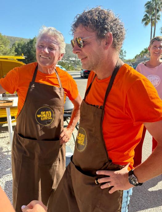 Guests queueing for hotdogs at an event